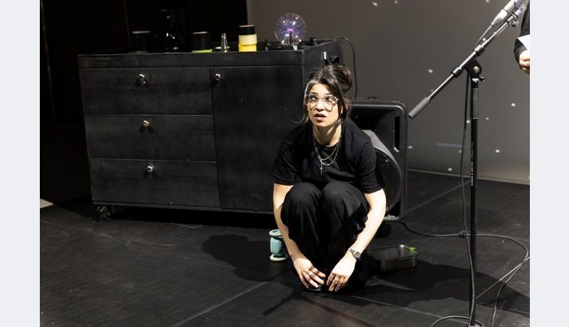 Actress sitting on the floor