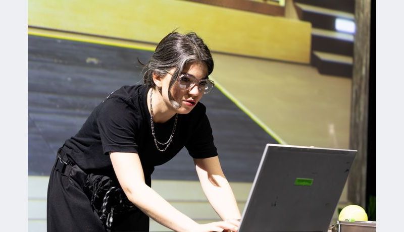 Actors looking at a laptop